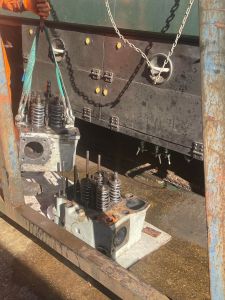 The replacement cylinder head being craned into the loco. Photo by Georgia Williams