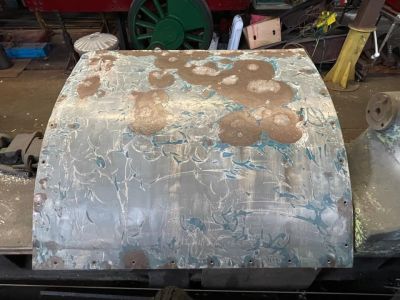 The fuel header tank outer section being rubbed down to inspect for rust and holes. Photo by Paul Seaman