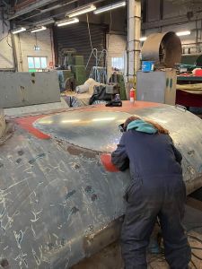 Old boiler flue hole having its new cover welded into place. Photo by Paul Seaman