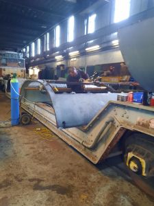 Grinding on the power unit roof section. Photo by Libby Whincup