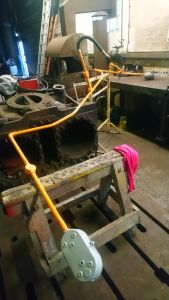 Electrical conduit being painted into gloss. Photo by Steve Rowston