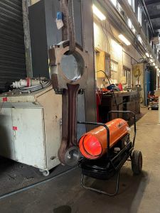 The little end of the conrod being warmed up ready for a new bearing. Photo by Paul Seaman