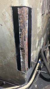 Panelling cut out, next this angle will be cut out and replaced. Photo by Georgia Williams