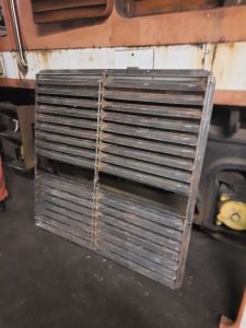 B side radiator grill being stripped of paint. Photo by James Whincup