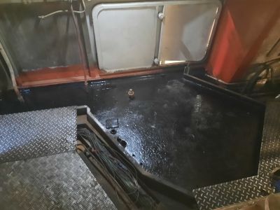 Boiler room floor after cleaning and painting. Photo by James Whincup