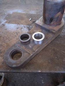 The brake hanger with old and new bushes. Photo by Steve Rowston