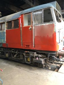 No.1 cab B side starting to see primer. Photo Latham King